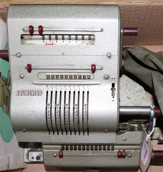 A Brunsviga 13 RK vintage calculating machine, with original cover and instruction manual